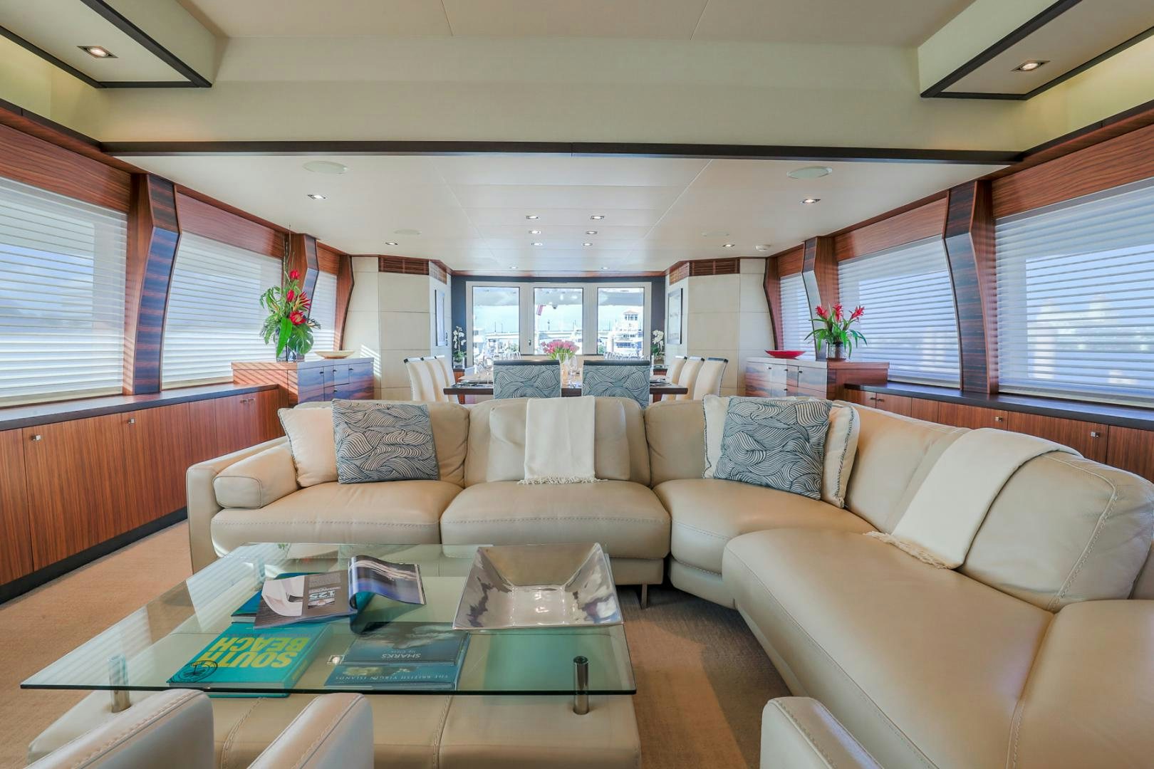 a living room with couches and a table aboard FUGITIVE *NAME RESERVED* Yacht for Sale