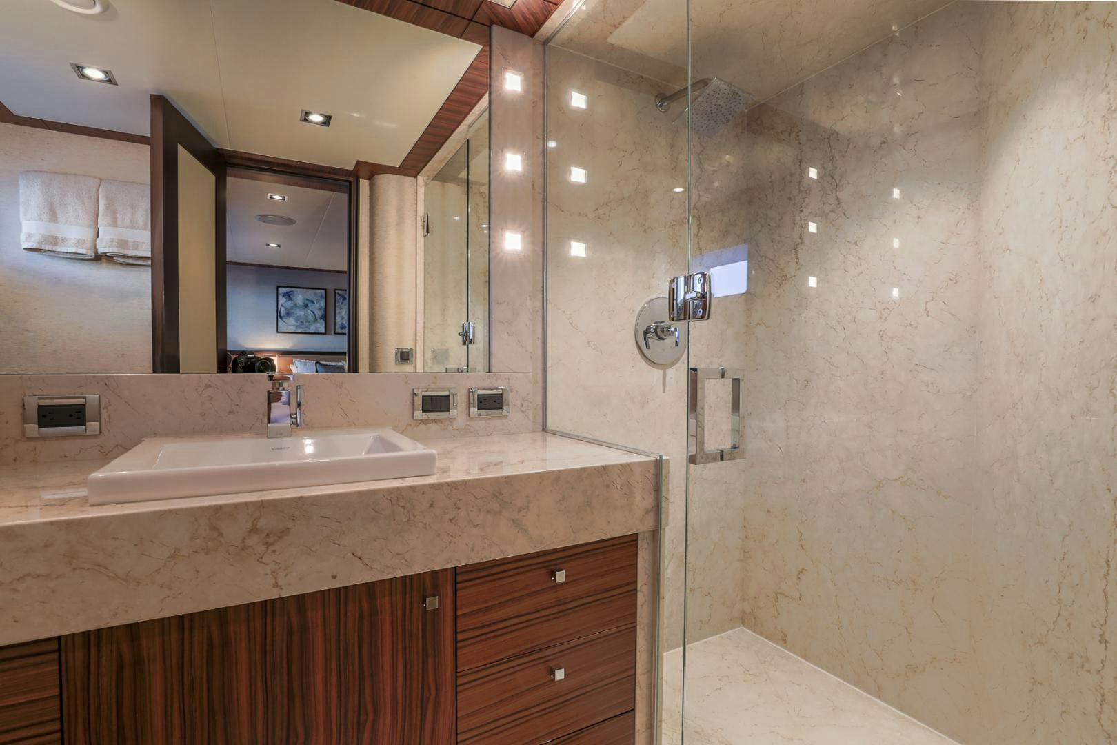 a bathroom with a large mirror aboard FUGITIVE *NAME RESERVED* Yacht for Sale