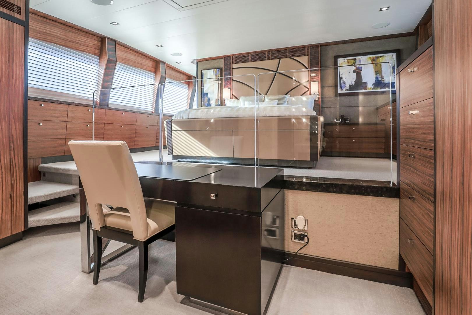 a room with a chair and a table and a bench aboard FUGITIVE *NAME RESERVED* Yacht for Sale