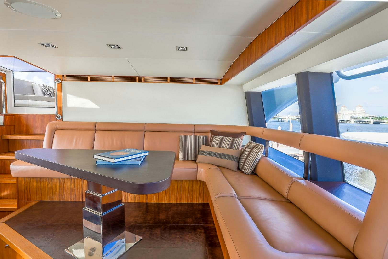 a room with a couch and a table aboard FUGITIVE *NAME RESERVED* Yacht for Sale