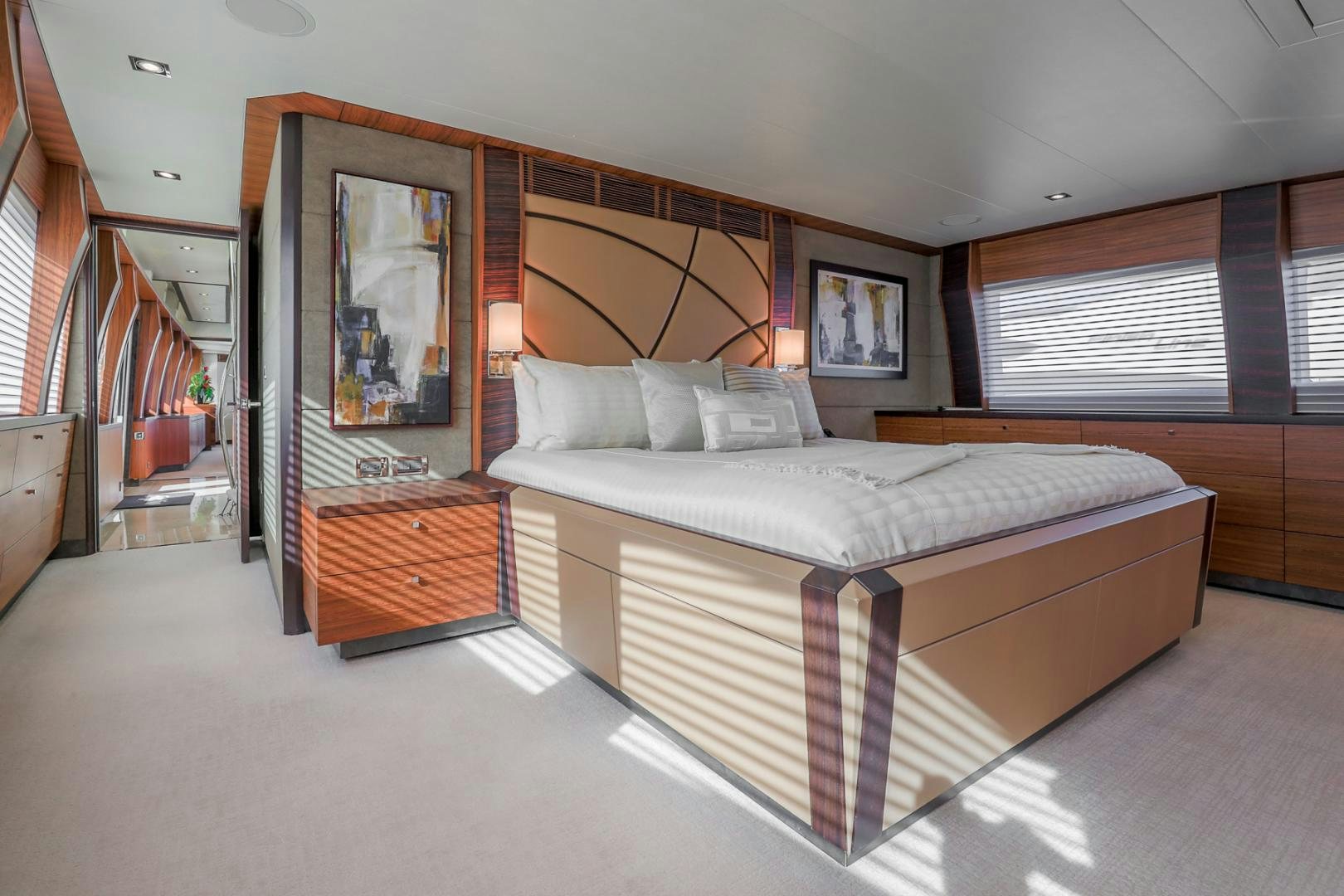 a bedroom with a bed and a mirror aboard FUGITIVE *NAME RESERVED* Yacht for Sale