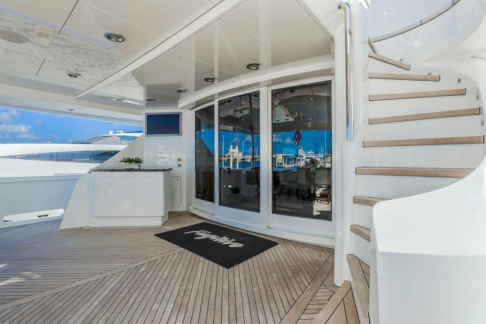 a modern house with a large glass door and a large window aboard FUGITIVE *NAME RESERVED* Yacht for Sale