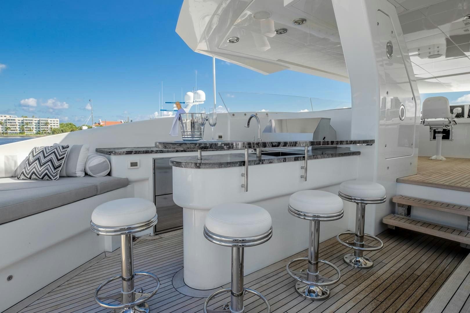 a bathroom with stools and a sink aboard FUGITIVE *NAME RESERVED* Yacht for Sale