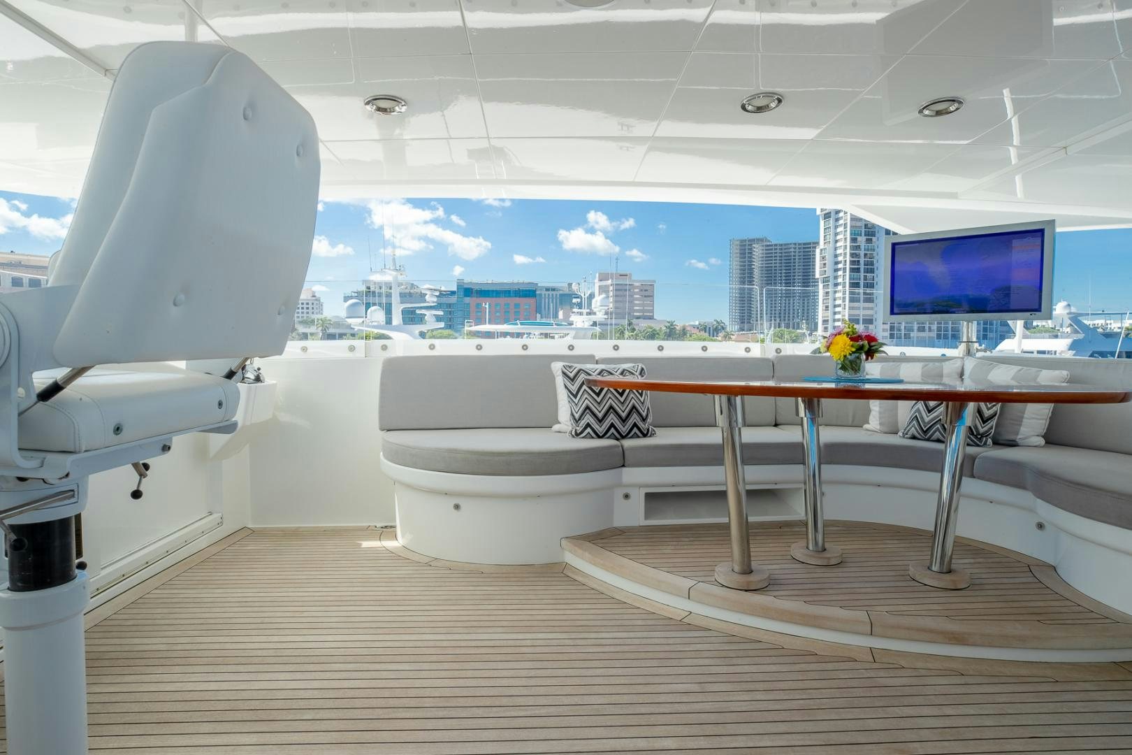 a room with a large window and a desk with a computer on it aboard FUGITIVE *NAME RESERVED* Yacht for Sale