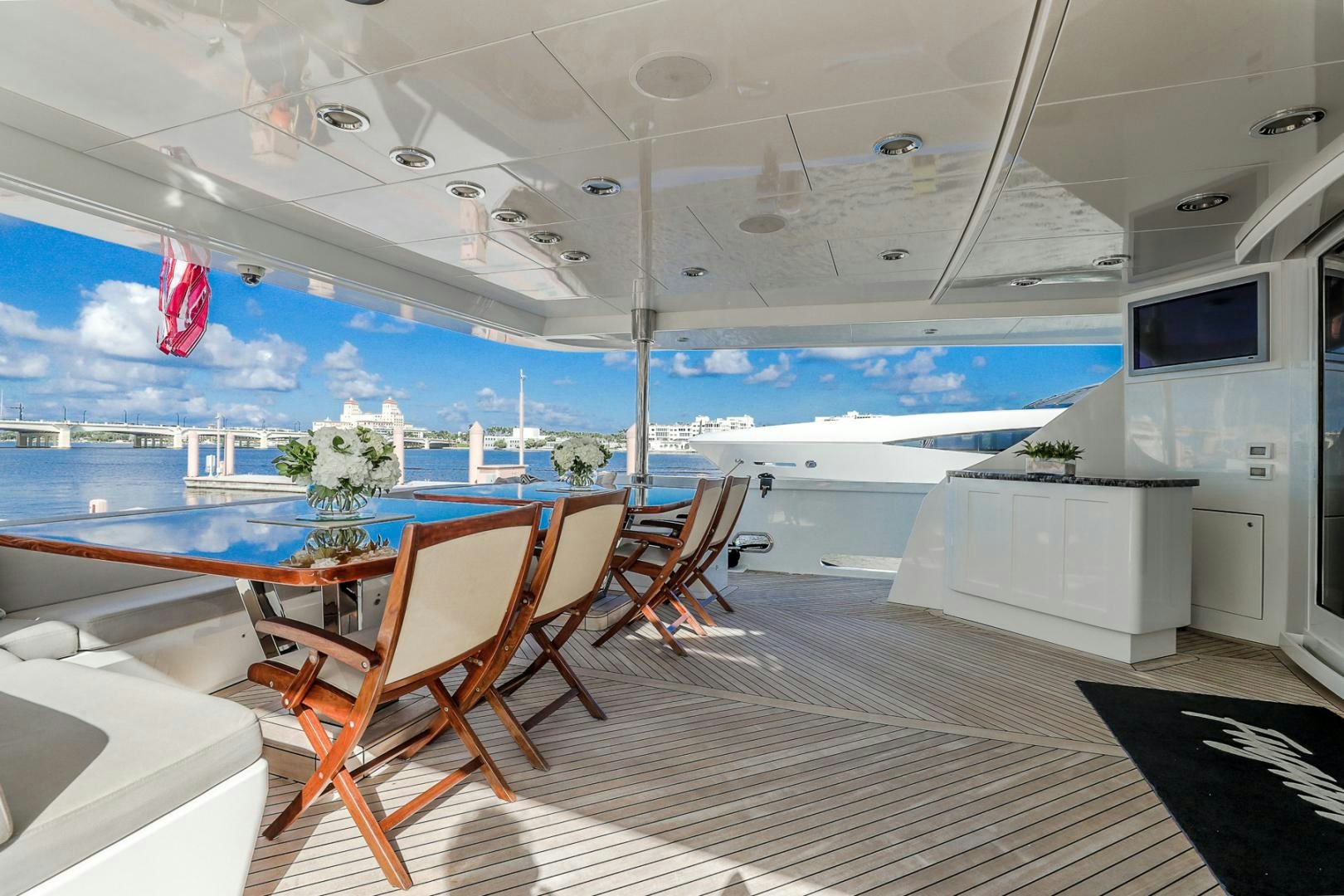 a room with a table and chairs aboard FUGITIVE *NAME RESERVED* Yacht for Sale