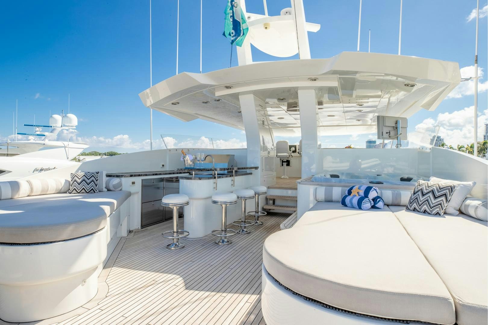 a large white boat in a large body of water aboard FUGITIVE *NAME RESERVED* Yacht for Sale