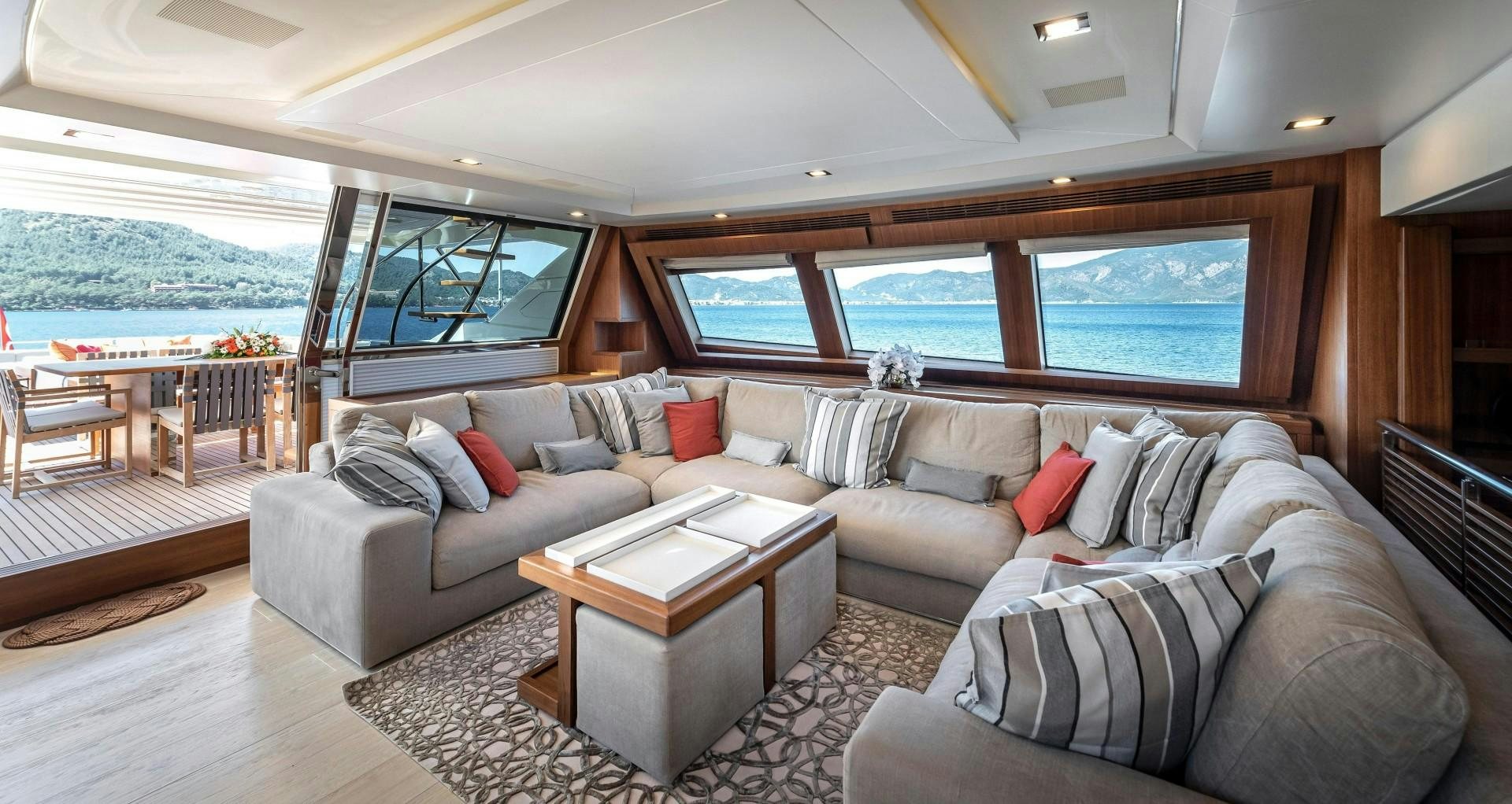 a living room with a couch and a table aboard ARGENTO Yacht for Sale