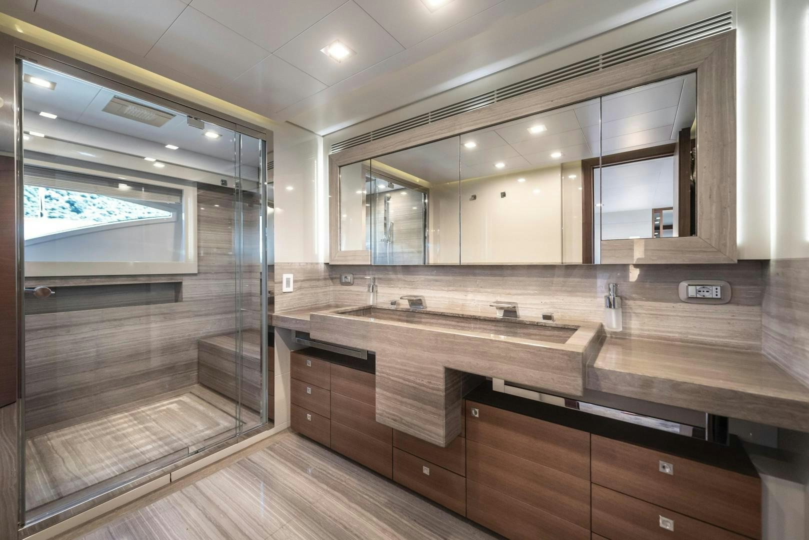 a bathroom with a large mirror aboard ARGENTO Yacht for Sale