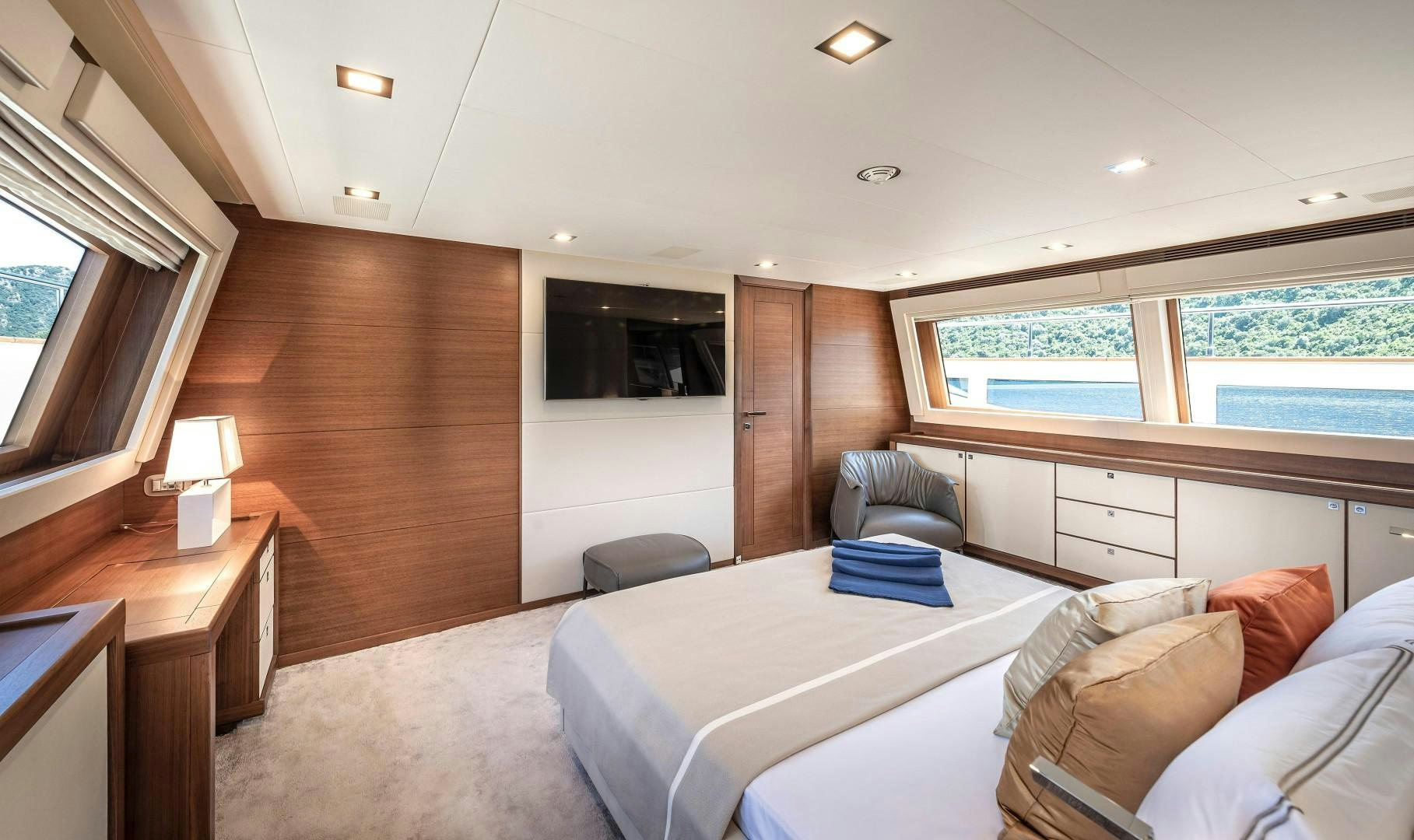 a room with a bed and a desk aboard ARGENTO Yacht for Sale