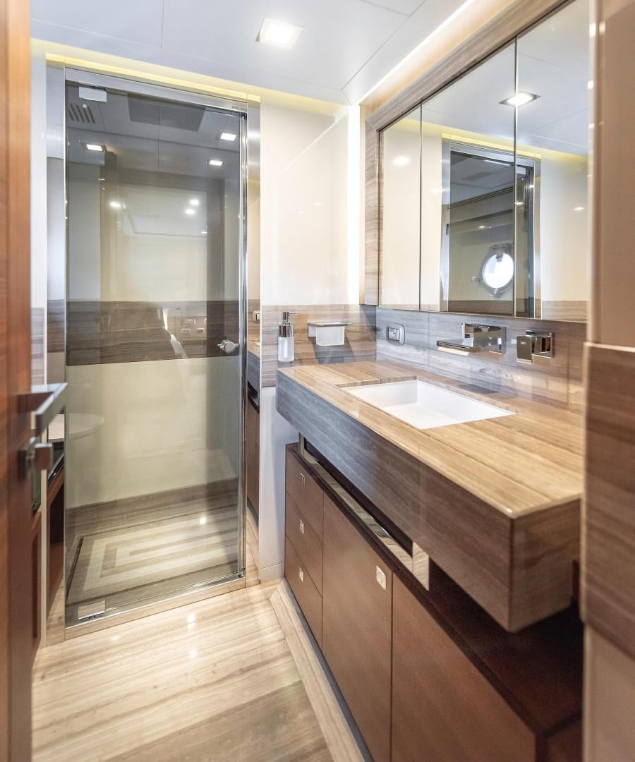 a bathroom with a large glass shower aboard ARGENTO Yacht for Sale