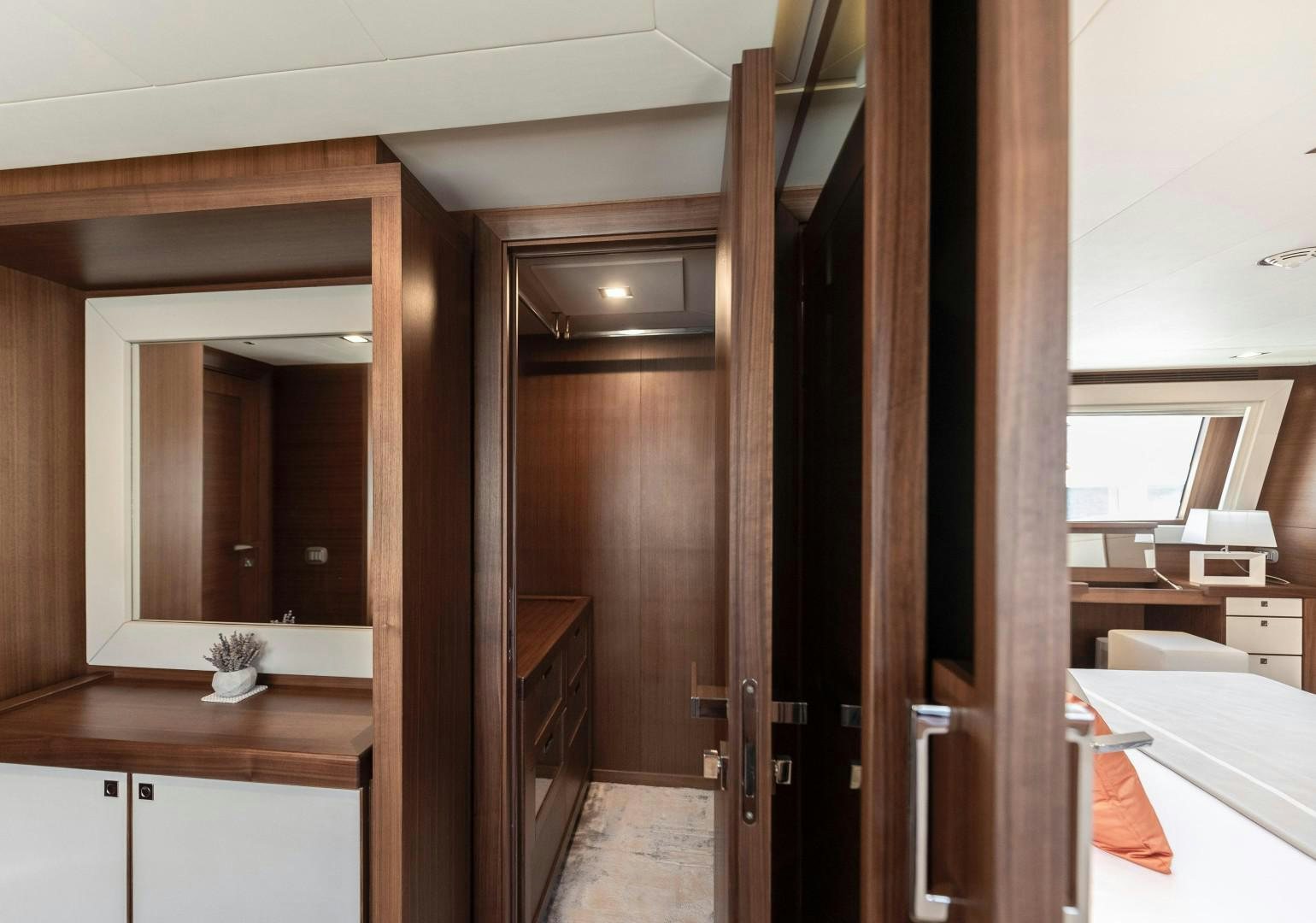 a room with a closet and a bed aboard ARGENTO Yacht for Sale