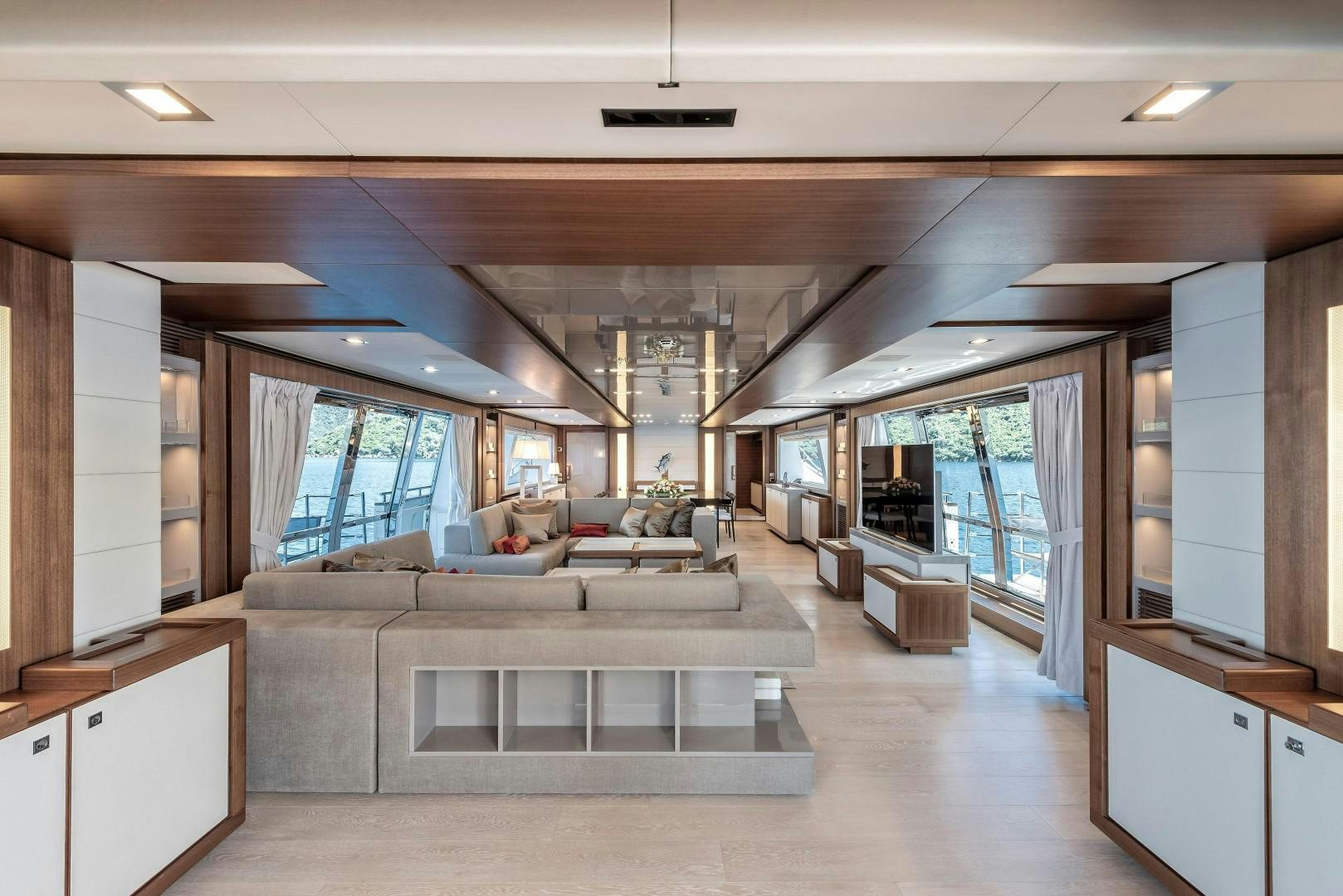 a large room with a couch and a table aboard ARGENTO Yacht for Sale