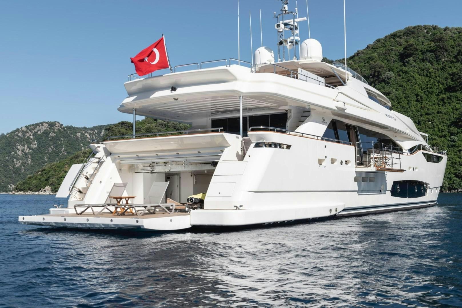 a large white ship with a flag on it aboard ARGENTO Yacht for Sale