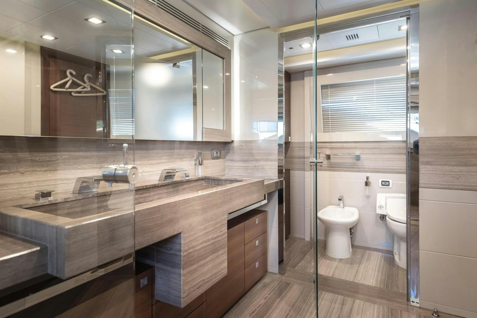 a bathroom with a large mirror aboard ARGENTO Yacht for Sale