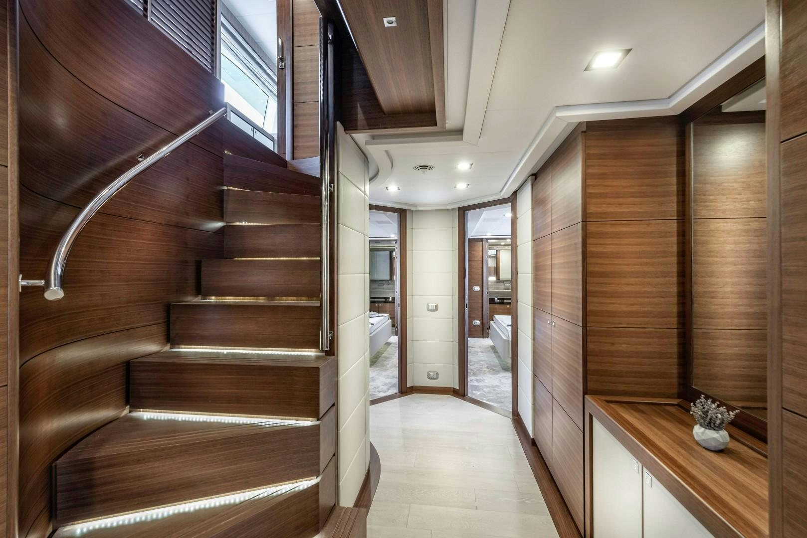 a hallway with wood walls and a staircase aboard ARGENTO Yacht for Sale