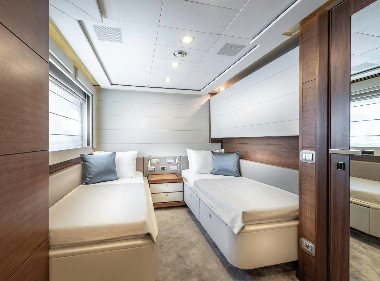 a room with a bed and a desk aboard ARGENTO Yacht for Sale