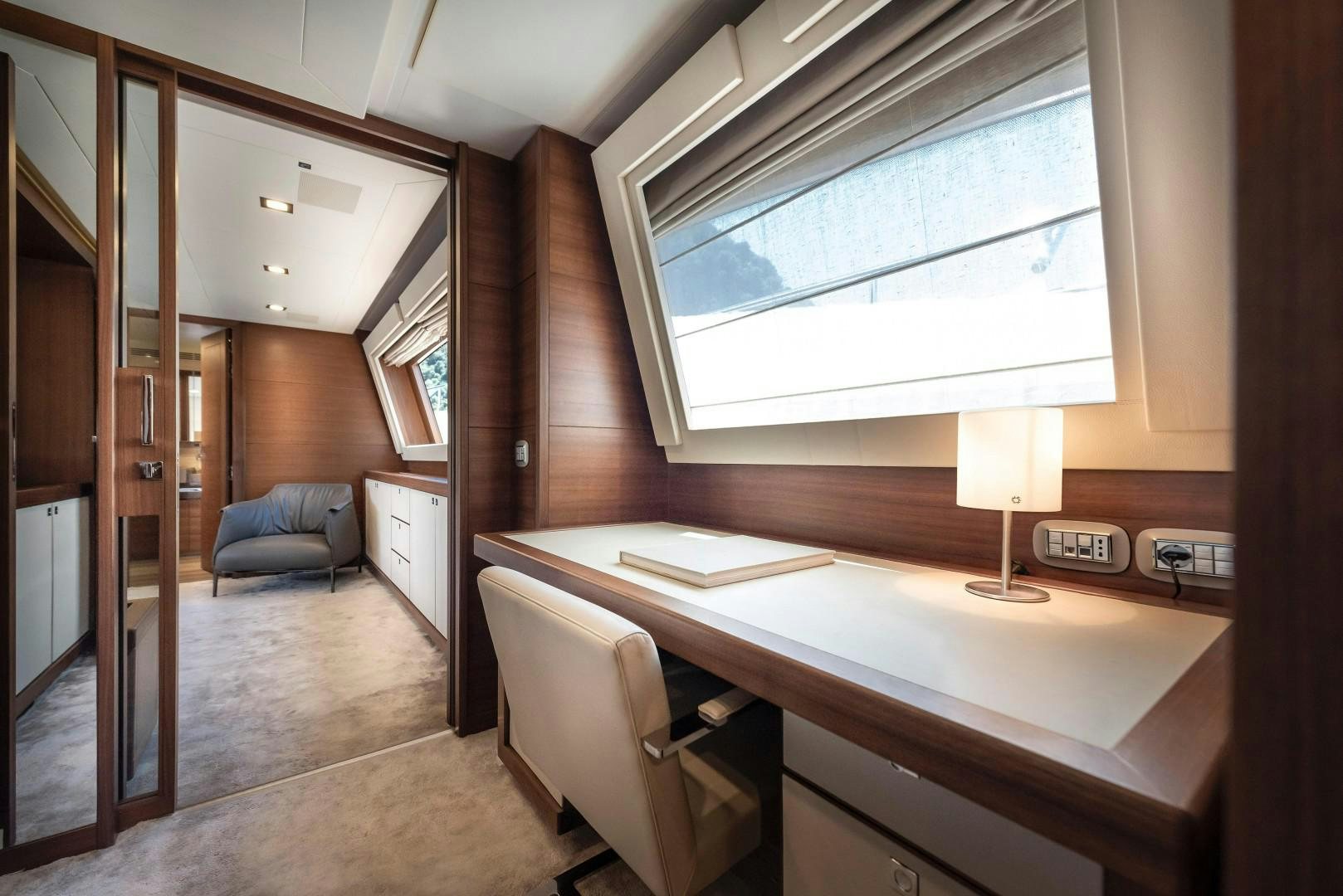 a room with a desk and a window aboard ARGENTO Yacht for Sale