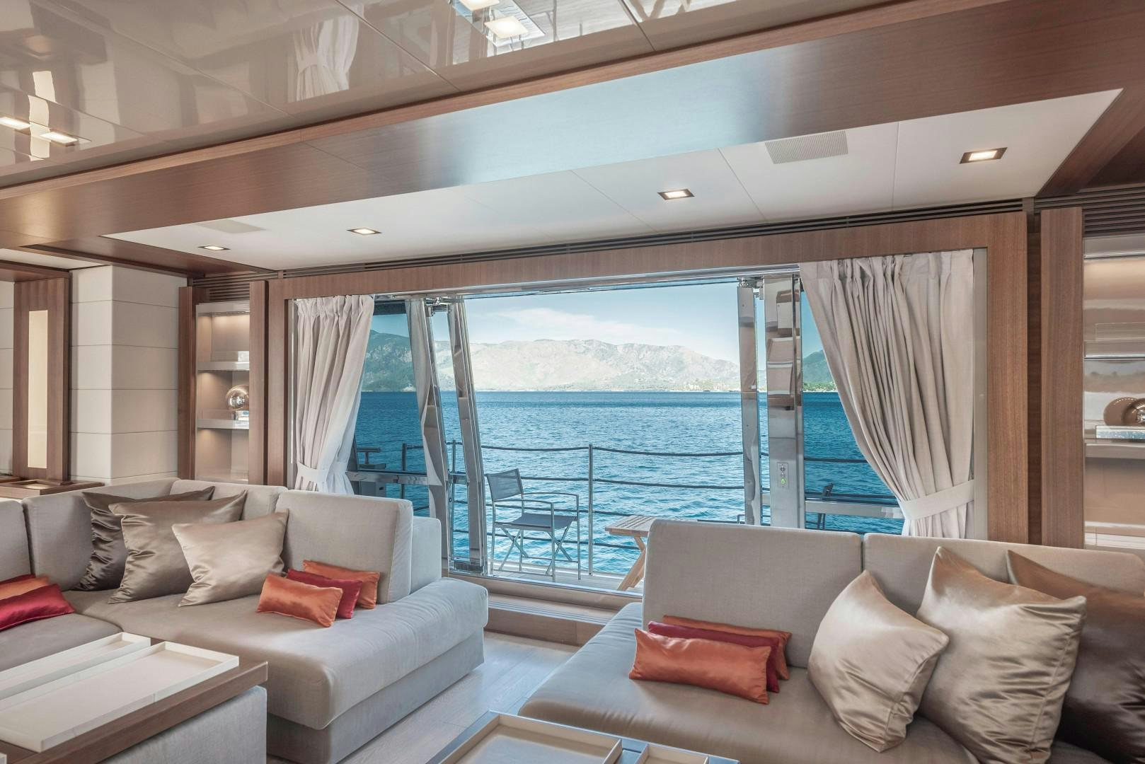 a living room with a large window aboard ARGENTO Yacht for Sale
