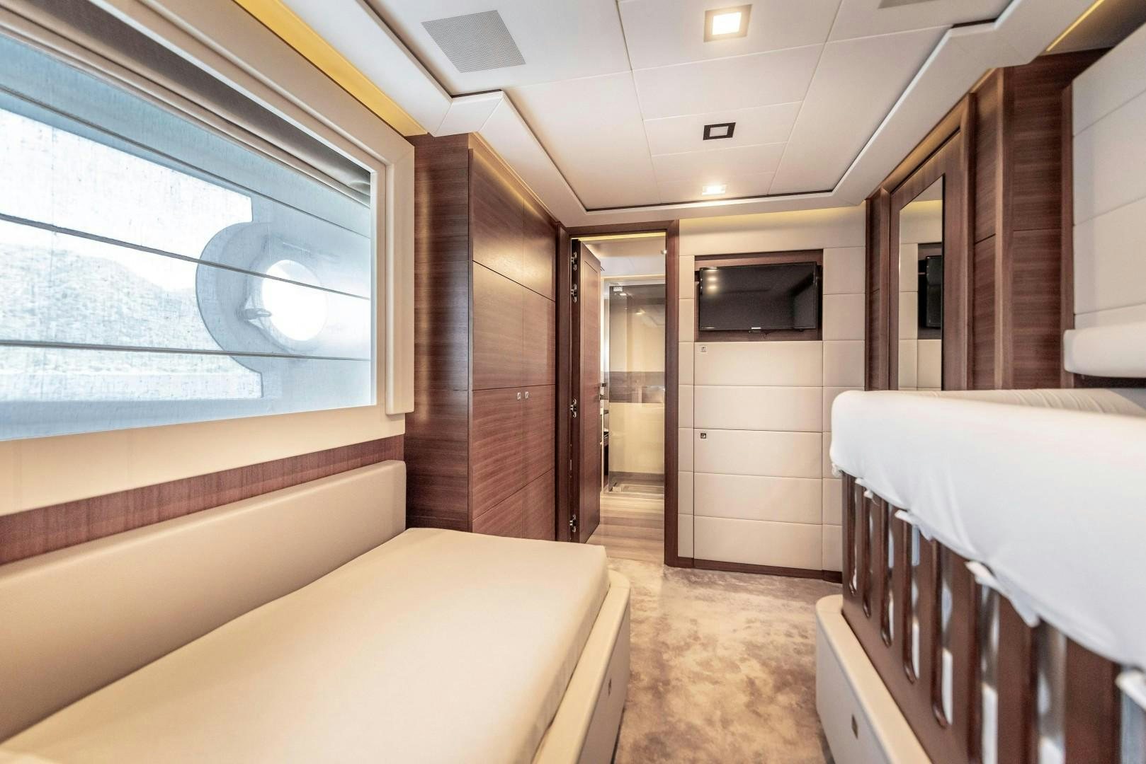 a room with a bed and a window aboard ARGENTO Yacht for Sale