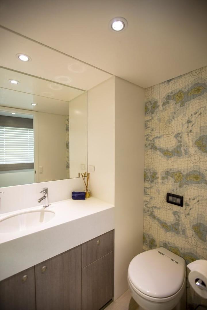 a bathroom with a sink and a toilet aboard KAHU Yacht for Sale