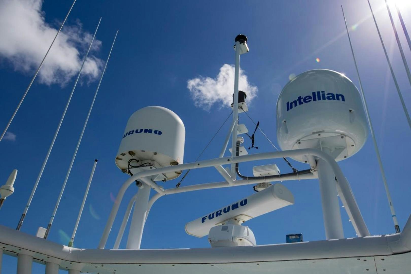 a group of white satellite dishes aboard KAHU Yacht for Sale