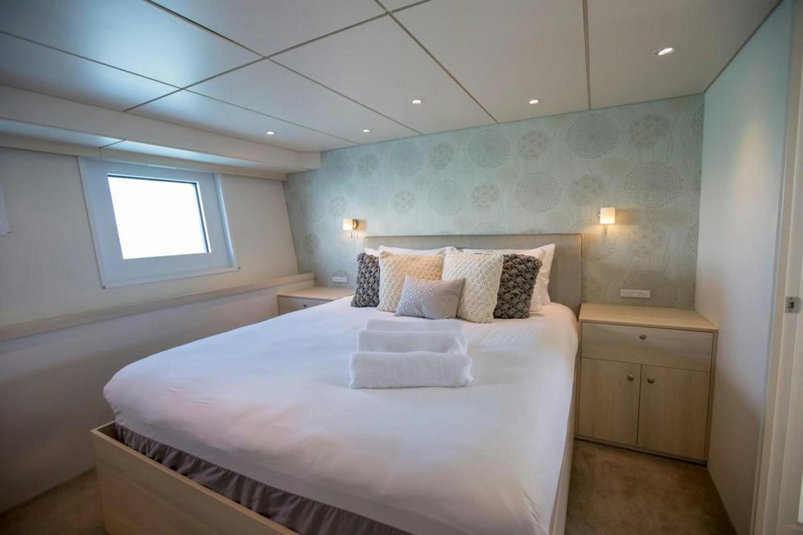 a room with two beds aboard KAHU Yacht for Sale