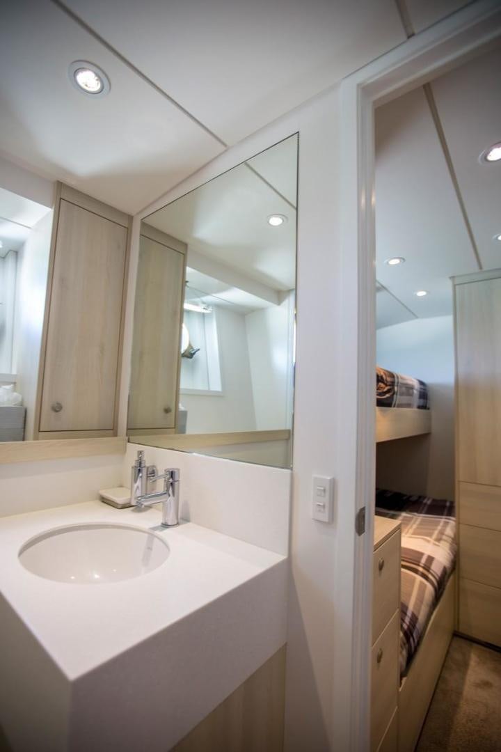 a bathroom with a large mirror aboard KAHU Yacht for Sale