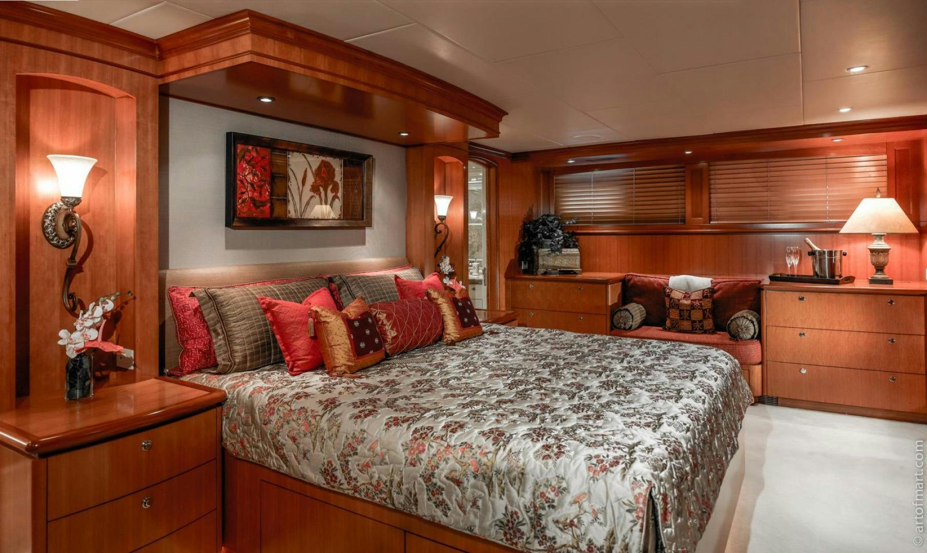 a bedroom with a bed and a chair aboard MURPHY'S LAW Yacht for Sale