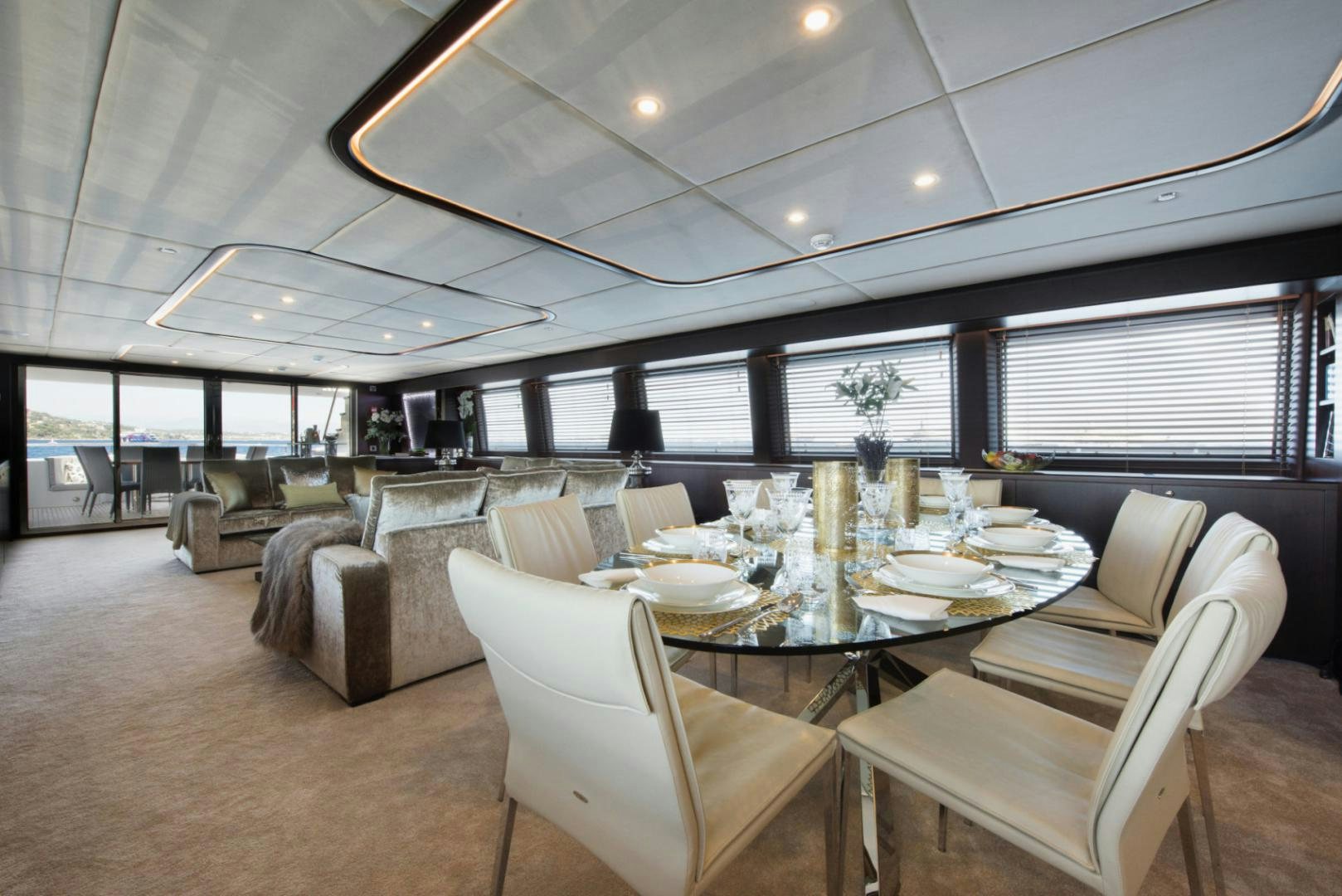 a large room with a table and chairs aboard CRYSTAL Yacht for Sale