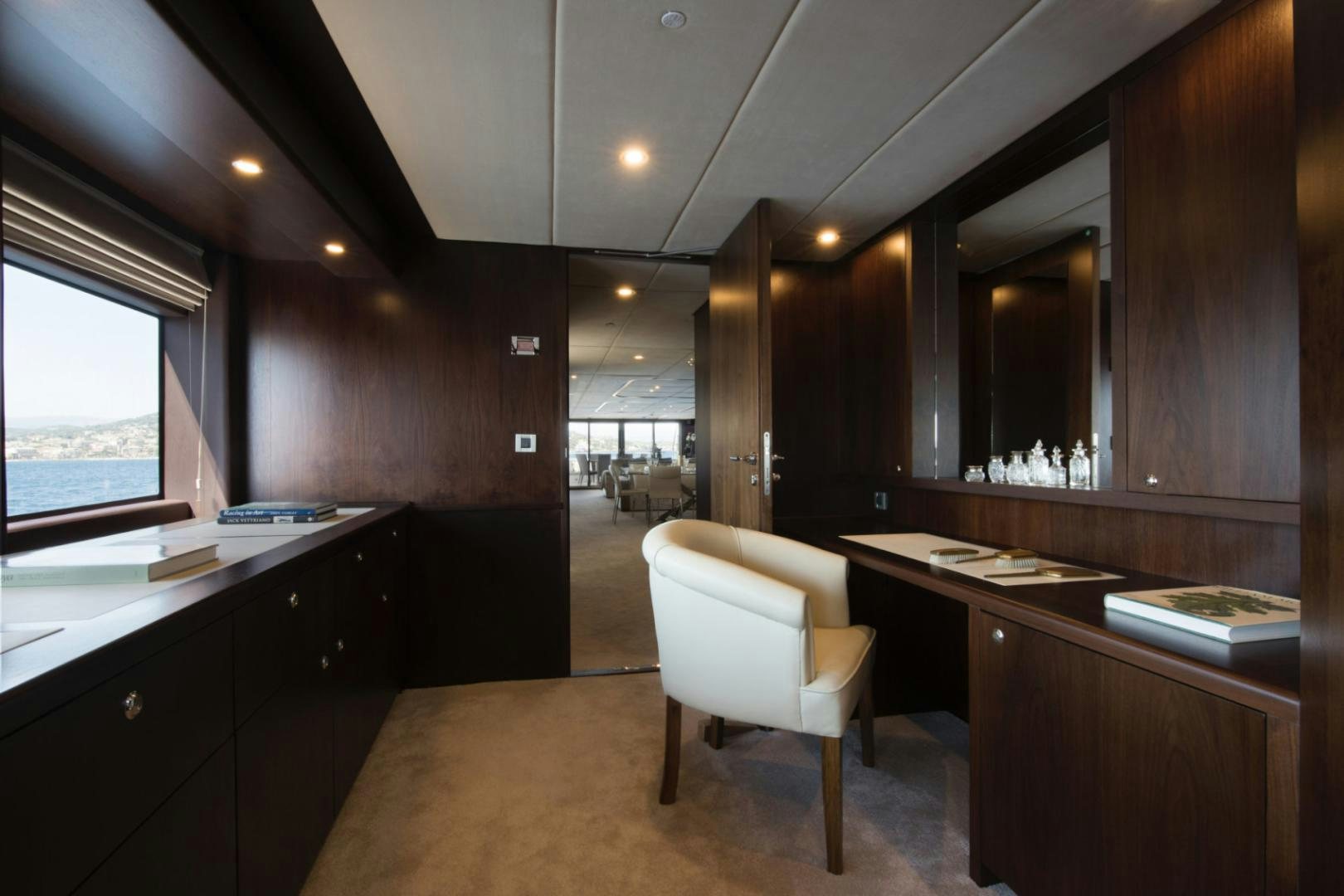 a kitchen with a bar and a table aboard CRYSTAL Yacht for Sale