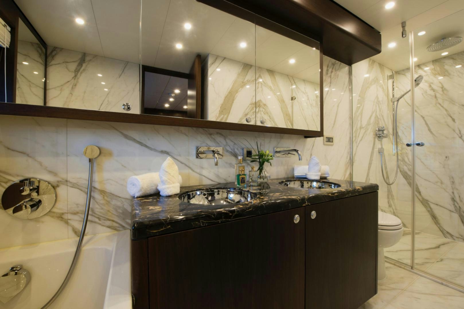 a bathroom with a large mirror aboard CRYSTAL Yacht for Sale