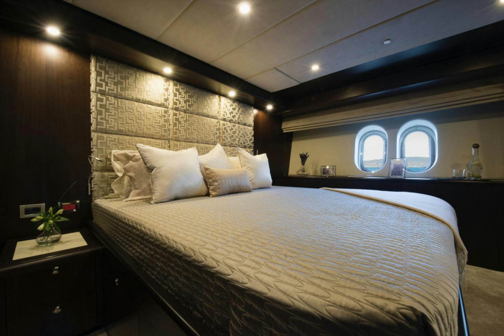 a bed with white sheets aboard CRYSTAL Yacht for Sale