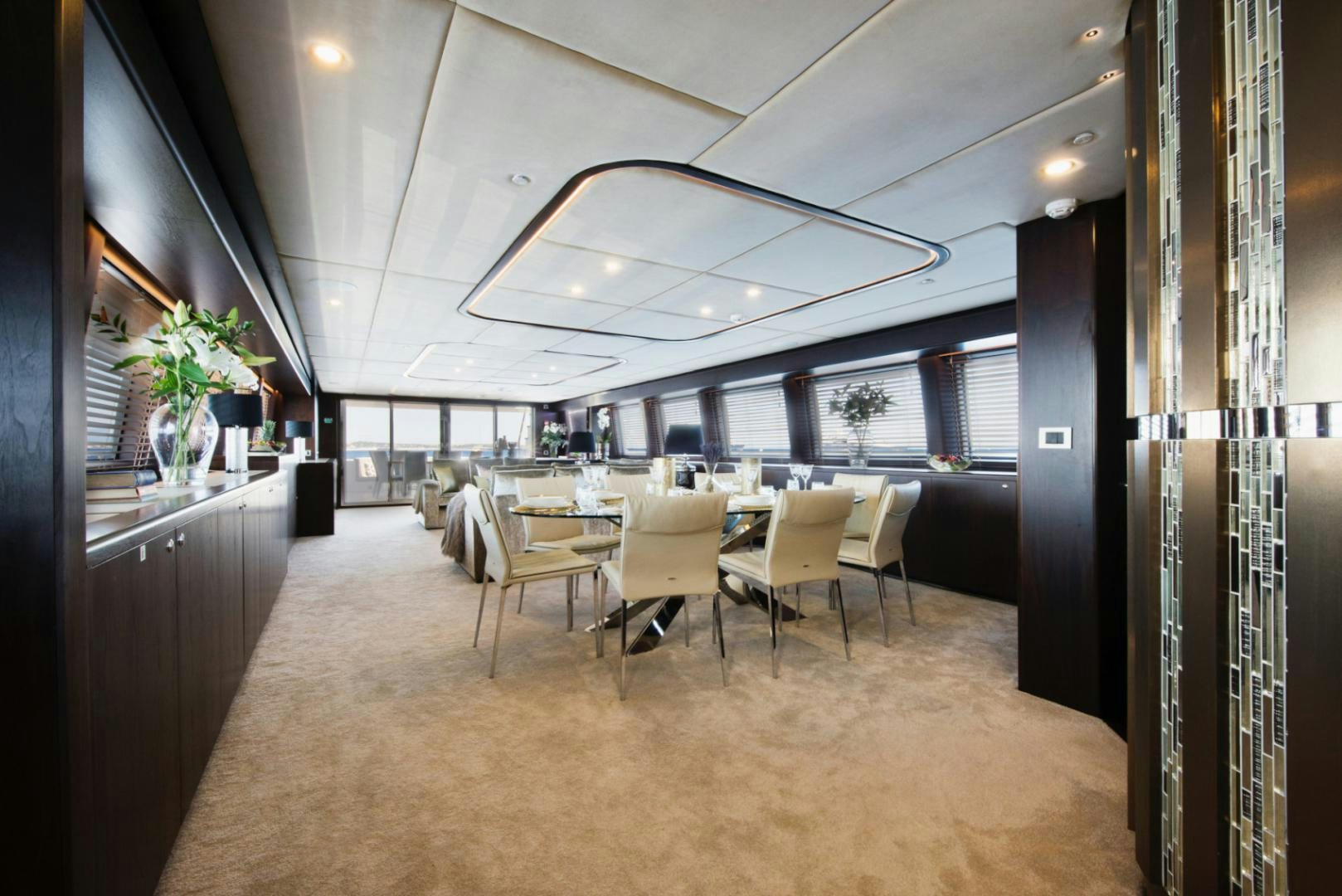 a room with a table and chairs aboard CRYSTAL Yacht for Sale