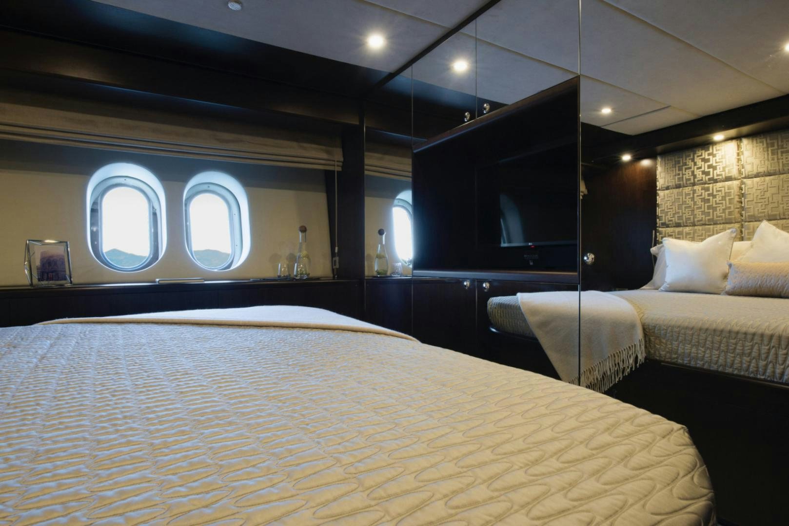 a room with two beds aboard CRYSTAL Yacht for Sale