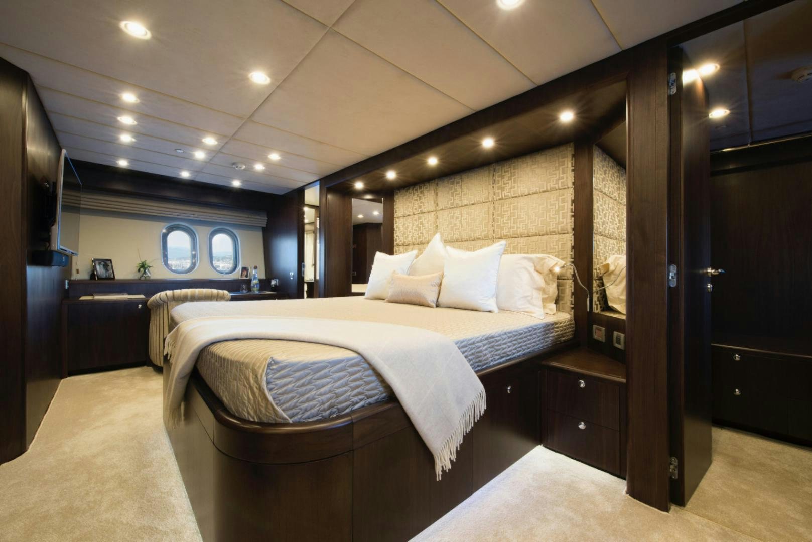 a bedroom with a large bed aboard CRYSTAL Yacht for Sale