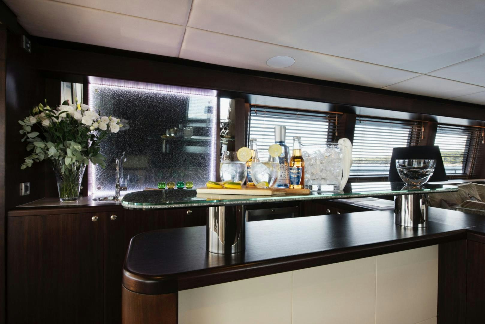 a kitchen with a large island aboard CRYSTAL Yacht for Sale