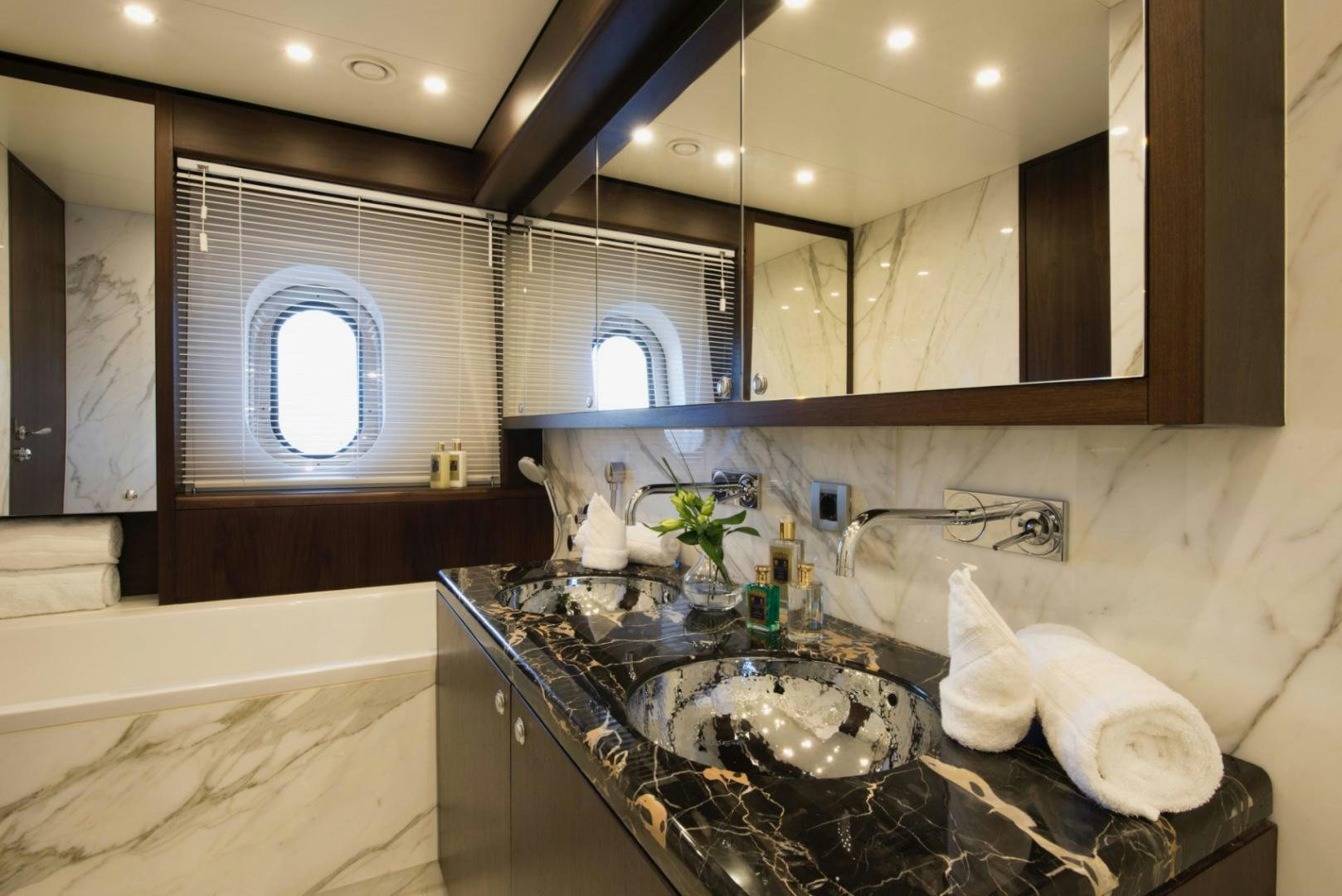 a bathroom with a marble counter top aboard CRYSTAL Yacht for Sale