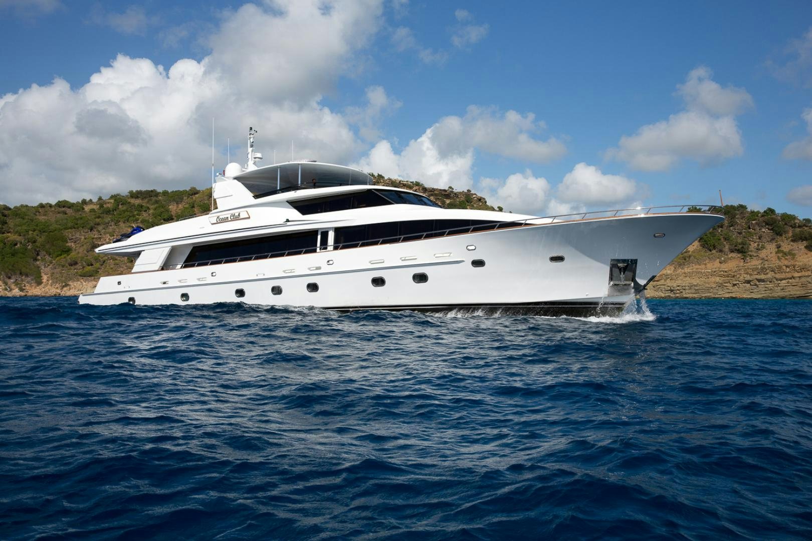 a white yacht in the water aboard OCEAN CLUB Yacht for Sale