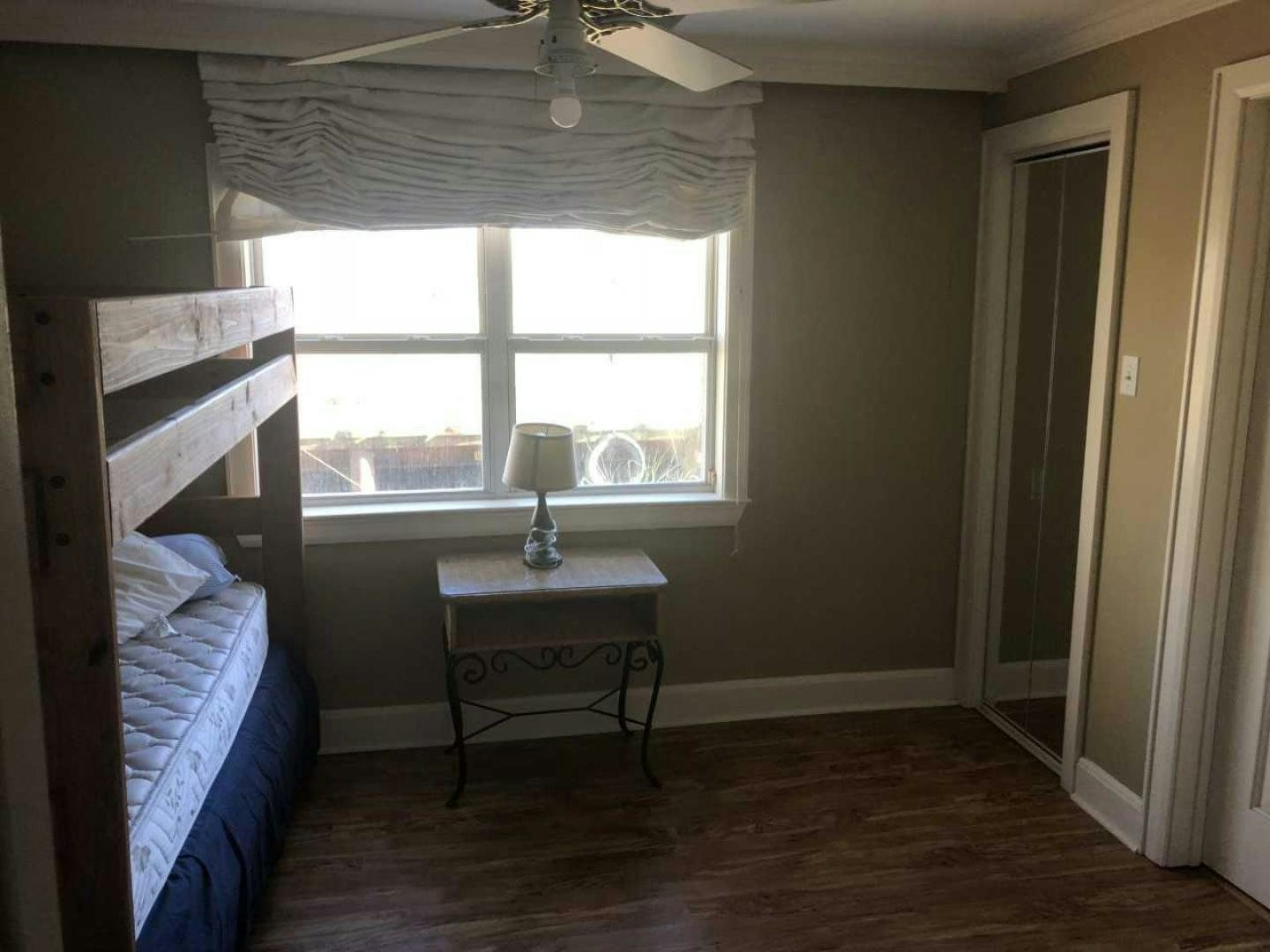 a bedroom with a bed and a table aboard LAKEHOUSE Yacht for Sale