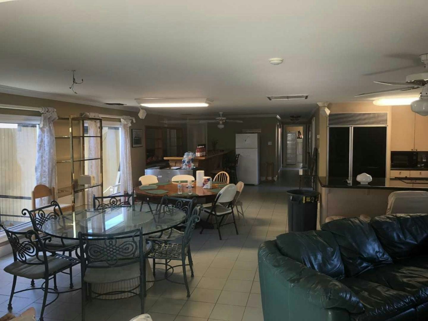 a living room with a couch and a table aboard LAKEHOUSE Yacht for Sale