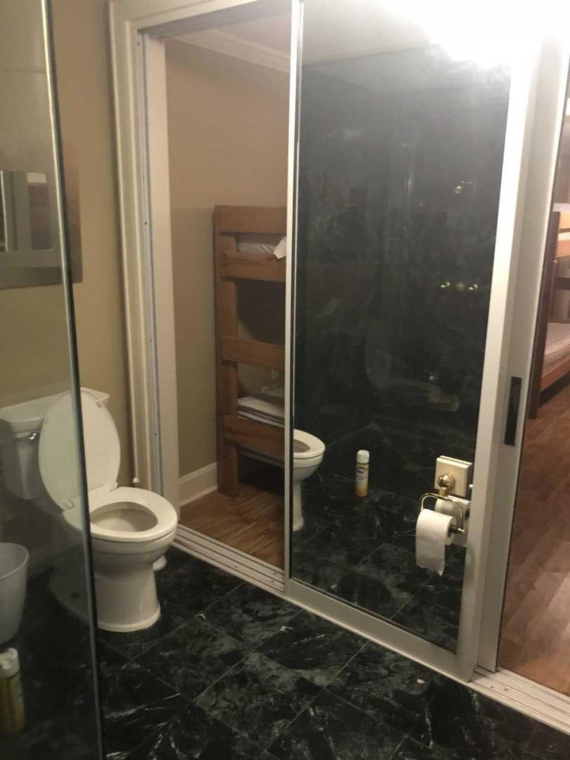a bathroom with a glass door aboard LAKEHOUSE Yacht for Sale