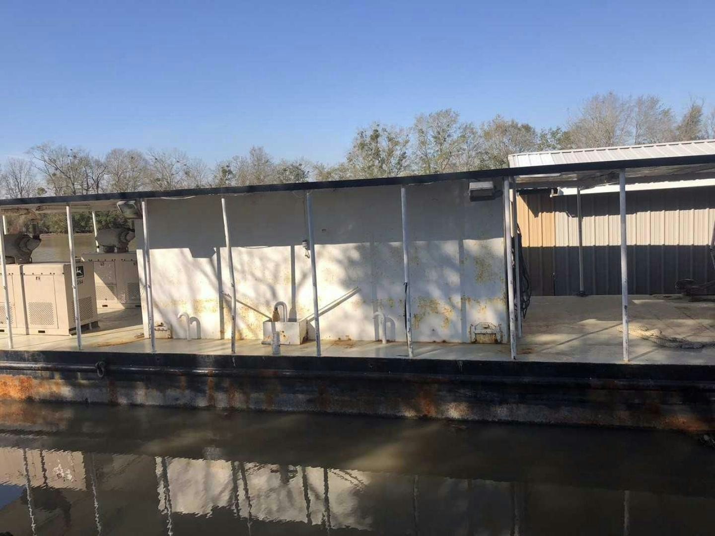 a large metal wall with a water fountain in front of it aboard LAKEHOUSE Yacht for Sale