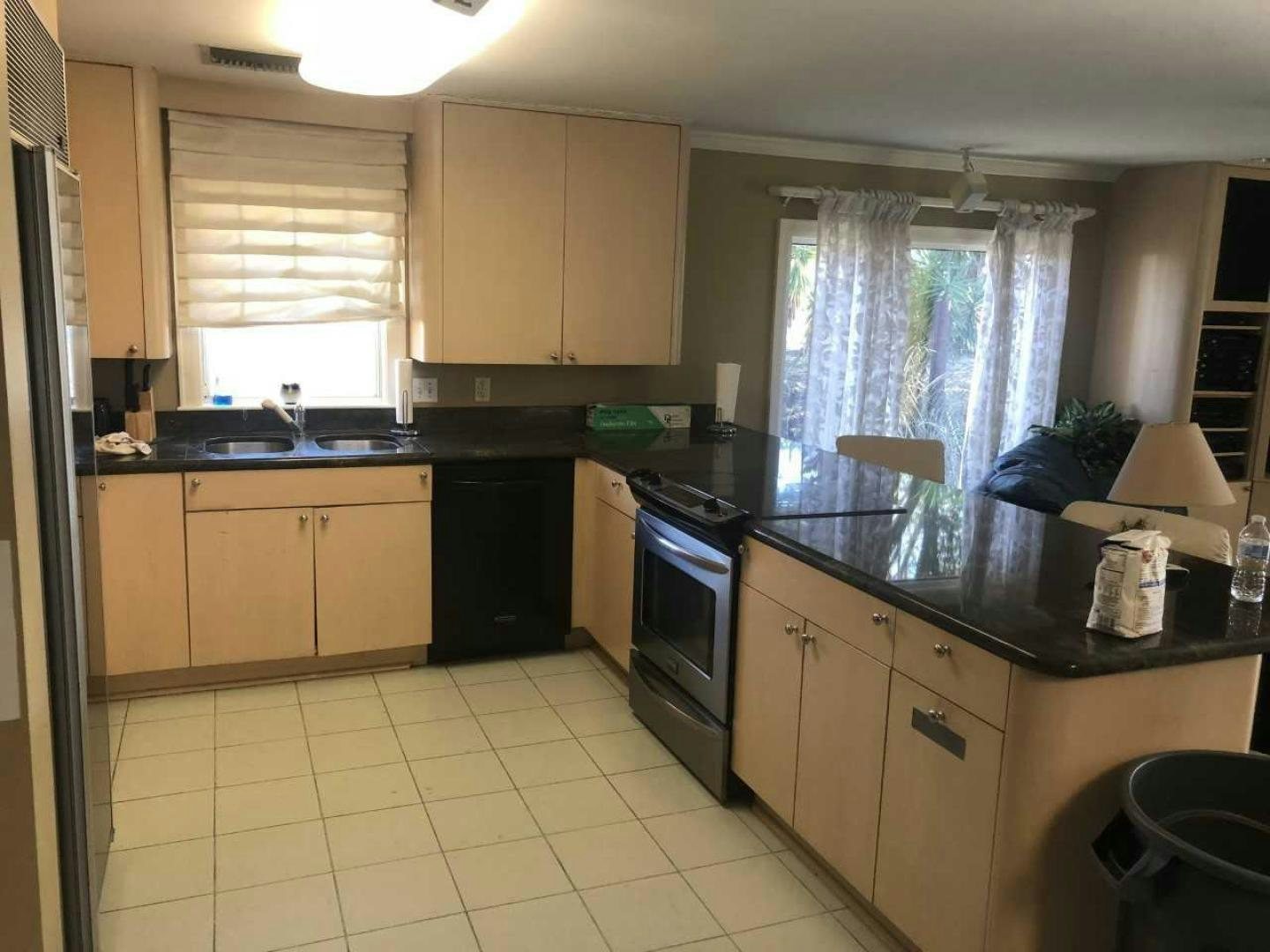 a kitchen with white tiles aboard LAKEHOUSE Yacht for Sale