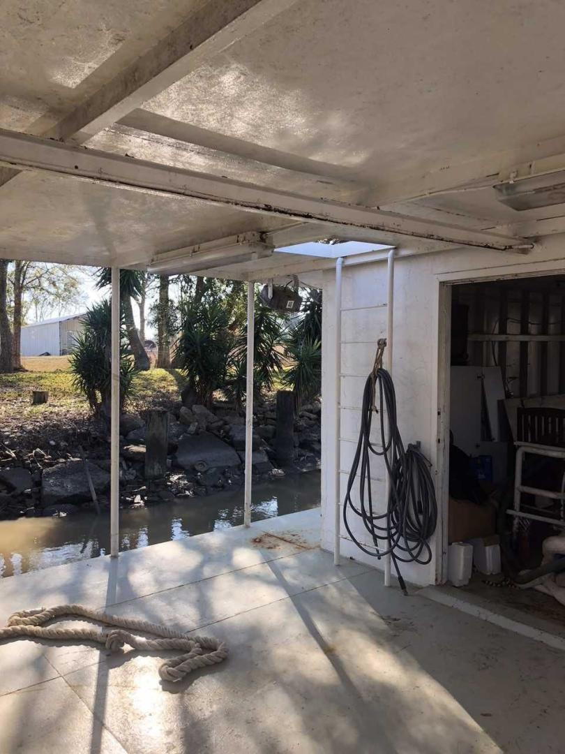 a room with a door and a window with a broken glass aboard LAKEHOUSE Yacht for Sale