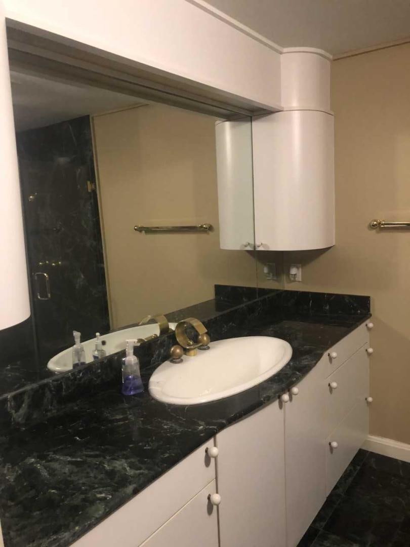 a bathroom with a sink and a mirror aboard LAKEHOUSE Yacht for Sale