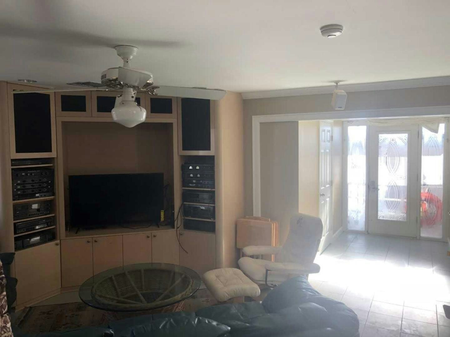 a living room with a fireplace aboard LAKEHOUSE Yacht for Sale