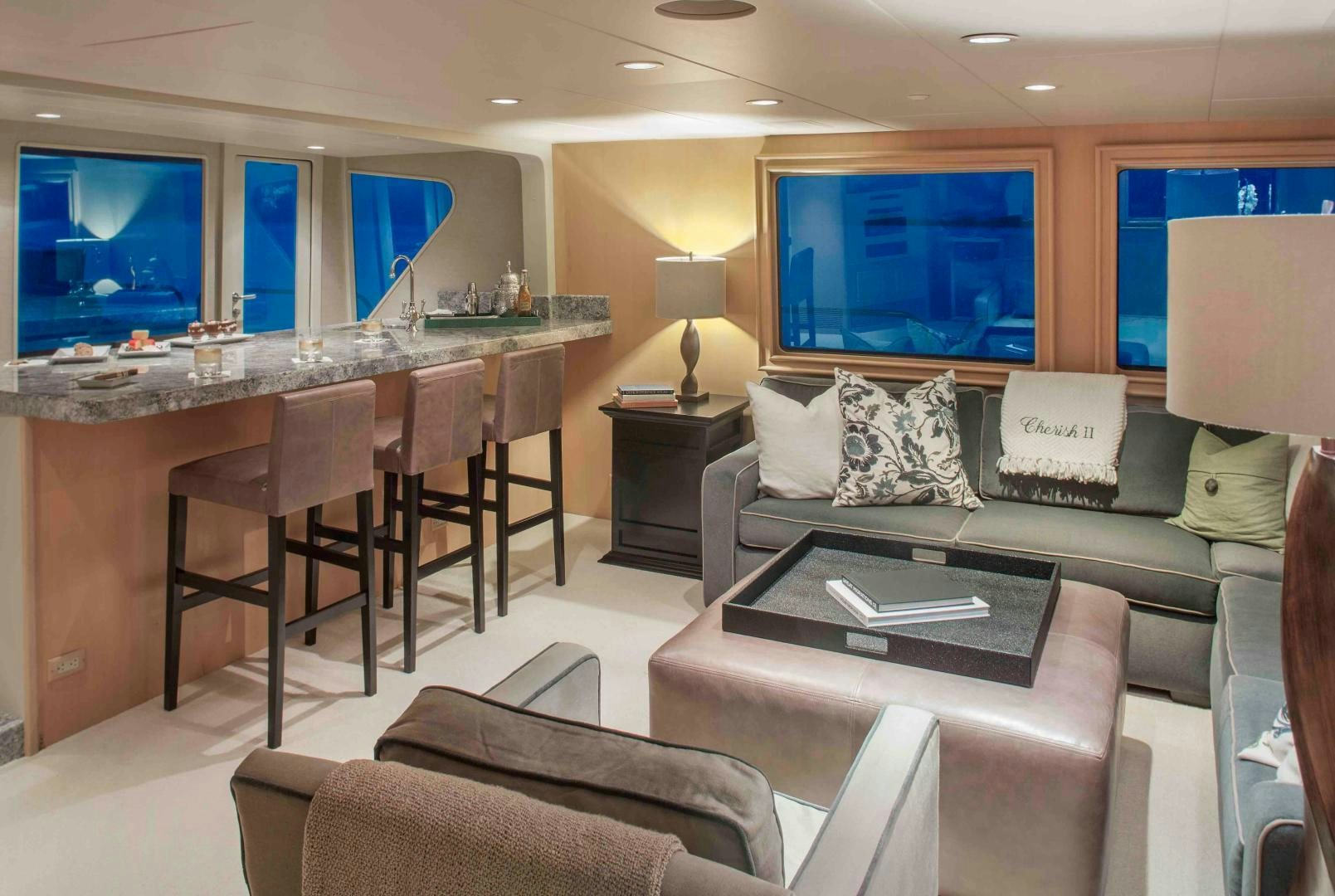 a living room with a couch and a table aboard CHERISH Yacht for Sale