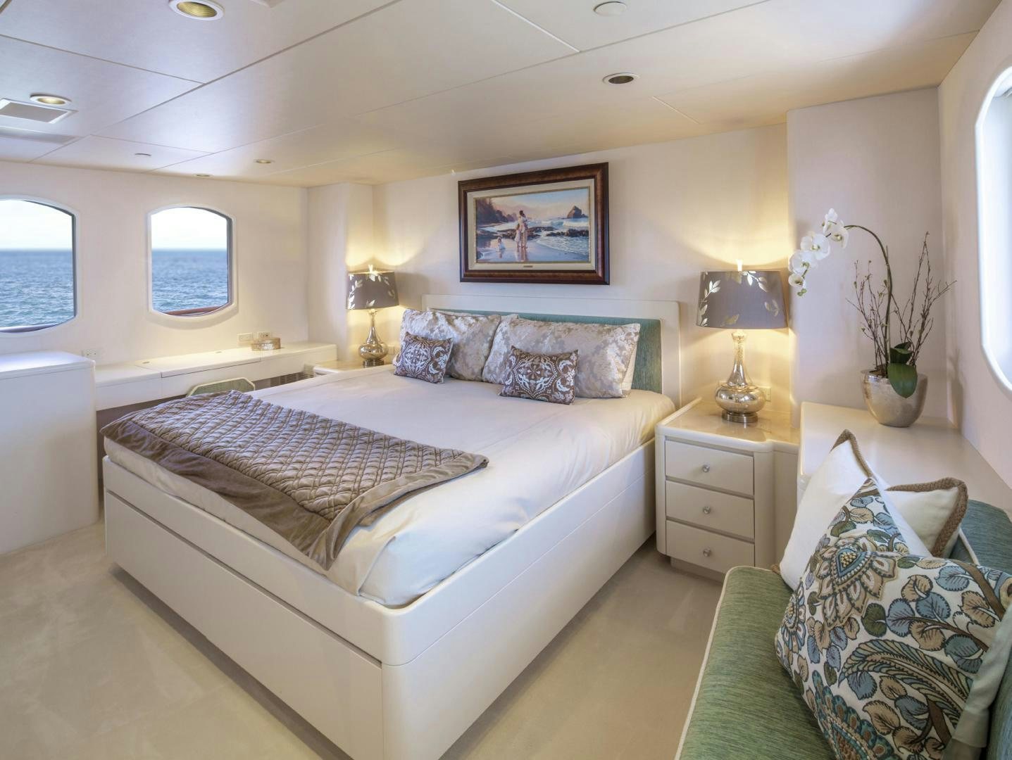 a bedroom with a bed and a lamp aboard CHERISH Yacht for Sale