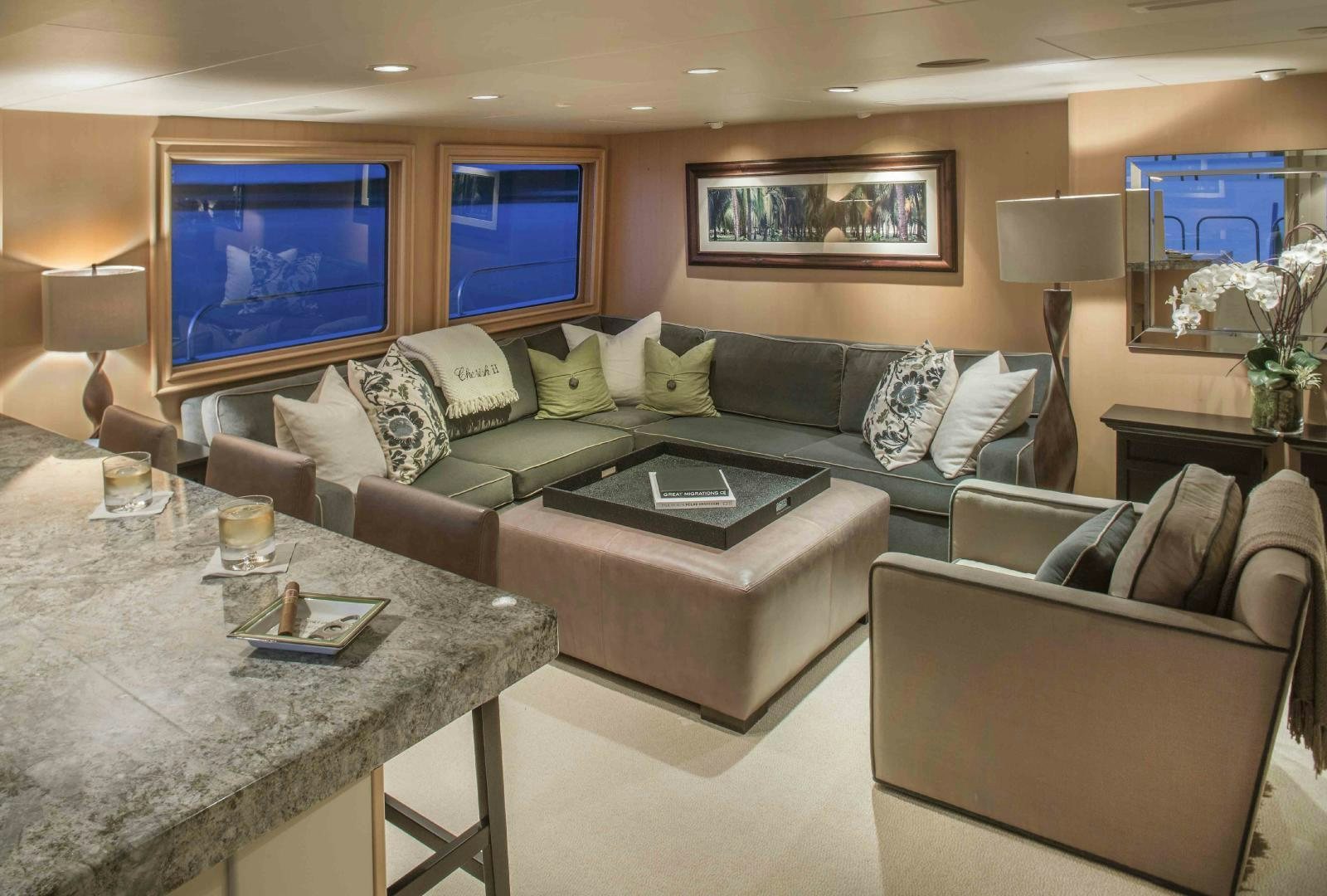 a living room with a large screen aboard CHERISH Yacht for Sale
