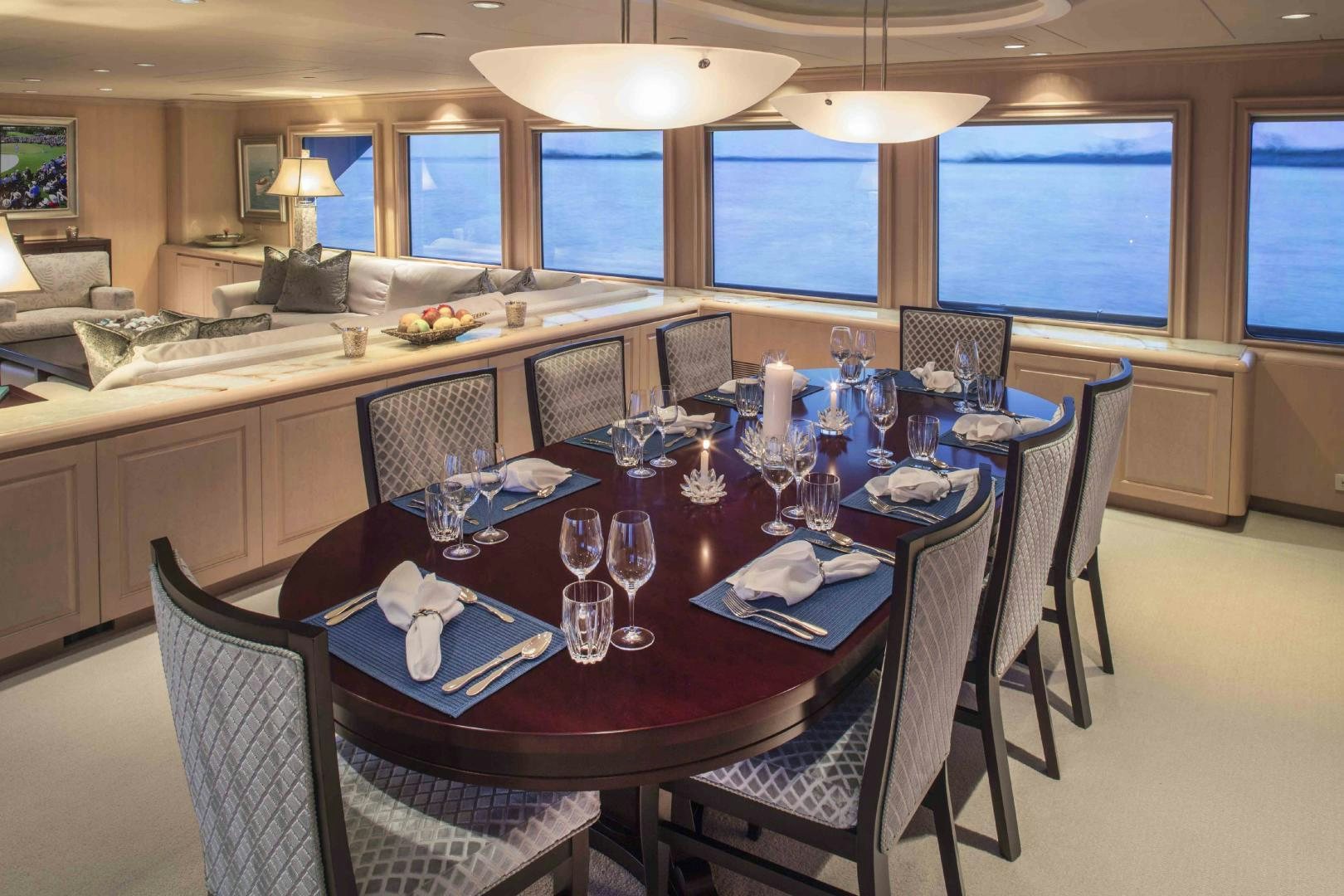 a dining room with a table set for a dinner aboard CHERISH Yacht for Sale